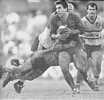 Michael Hagan standing in a tackle.
