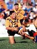 Roach is able to offload despite the tackle of Michael Hagan.