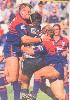Paul Harragon makes a tackle.