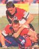 David Florimo and David Fairleigh combine to flatten Paul Harragon.