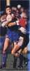 Darren Treacy is smothered by a Norths defender.