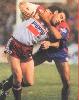 Brett Grogan drags down Danny Moore.