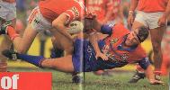 Adam Muir pulls down Dean Callaway.