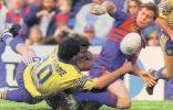 Jamie Ainscough flicks a pass away.