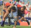 Bill Peden and Tim Maddison tackle Robbie Kearns.