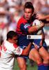 Matthew Johns looks to get the pass away.