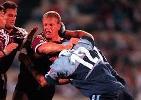 Adam Muir makes a tackle on Gary Larson.