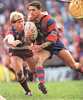 Robbie O'Davis tries to sprint past Geoff Toovey.