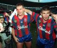 Paul Harragon and Andrew Johns celebrate the win.