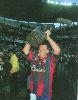 Adam Muir hoists the Optus Cup high.