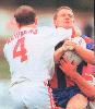 Bill Peden is tackled by Jamie Ainscough.