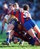 Mark Hughes tackles high.