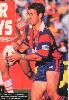 Andrew Johns puts on a jink.