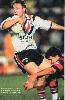 Darren Junee is driven backwards by Troy Fletcher.