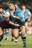 Paul Harragon smashes it forward.