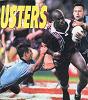 Andrew Johns and Laurie Daley pull down Wendell Sailor.