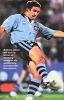 Andrew Johns puts the big boot to ball.