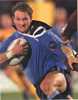 Adam MacDougall is caught by the jersey.