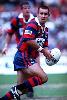 Matthew Johns about to get a ball away.