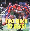 In his first non-Knights game, Adam Muir is crunched by Robbie O'Davis and Bill Peden.