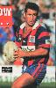 Andrew Johns holds up a pass.