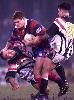 Evan Cochrane easily palms off a Penrith player.