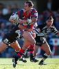 Matthew Johns almost slips into a gap ...