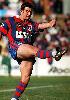A clearing kick by Andrew Johns.