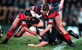 David Lomax and Neil Piccinelli make a tackle on Glenn Lazarus.