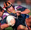 Tony Martin is pulled down by Jason Moodie.