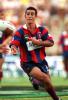 Andrew Johns launchs a pass in the season opener.