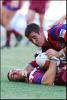 Andrew Johns tackles Daniel Gartner.