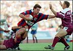 Matthew Gidley puts a huge fend on Brendon Reeves.