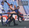 A Newcastle player is upended.