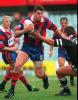 Peter Shiels fends off a Wests player.