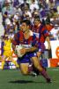 Andrew Johns steps through.