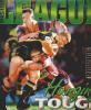A Cowboy is tackled by Tony Butterfield and Justin Holbrook.
