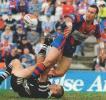 Matthew Johns flicks a nice pass away!