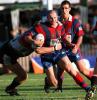 Adam MacDougall tries to beat a tackle.