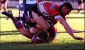 Erm ... a Norths player tackles a Knights player.