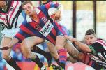 Bill Peden stretches for an extra metre.