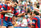 Andrew Johns and Matthew Johns celebrate a try.
