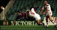 David Lomax gets a pass away despite being thumped.
