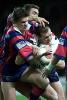Matthew Gidley tackles some stupid Sydney player.