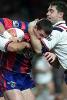 Steve Simpson tackled by Brad Fittler.
