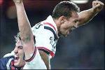 The Roosters celebrate hitting the lead.