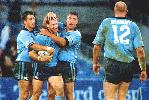 Adam MacDougall is congratulated after a try.