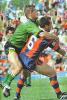 Matthew Johns chalks up an offload.