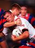 Former Knight Darren Treacey is tackled.