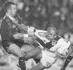 Matthew Johns tackles Anthony Mundine.